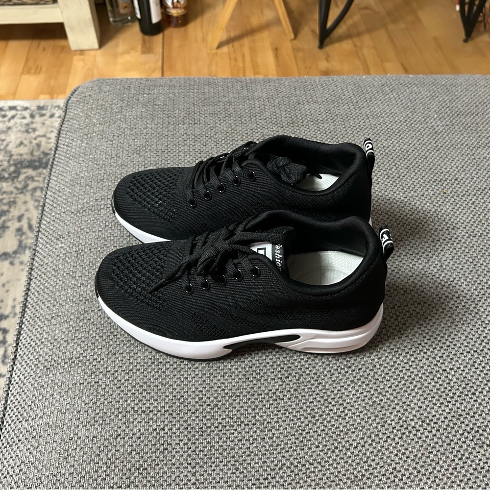 Women’s Black Athletic Shoes.  New never worn.  
Size 7